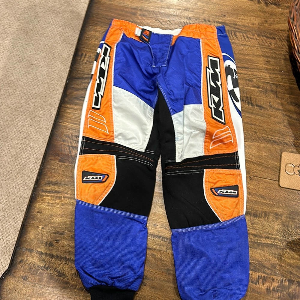 Thor 1210 KTM Motocross Pants w/pads. Size 26. Used see pics some stains.